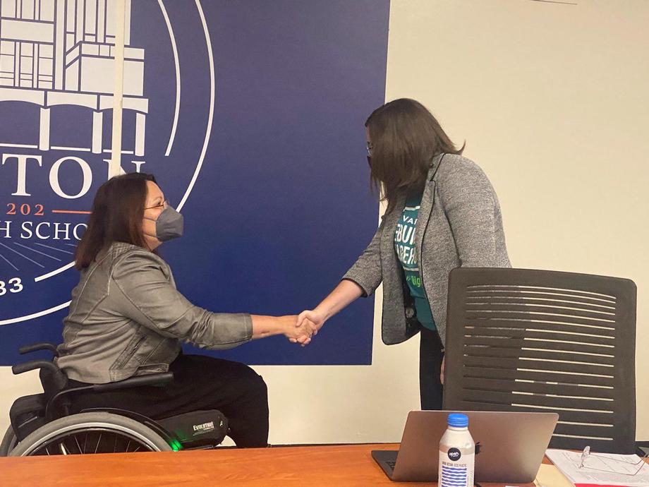 U.S. Senator Tammy Duckworth (D-IL) shaking hands with a community member who's engaged in workforce development.